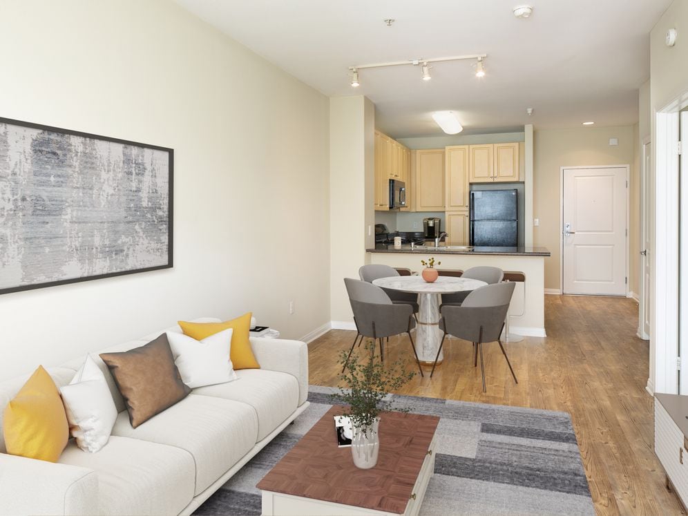 Kitchen, living, and dining areas with hard surface flooring throughout