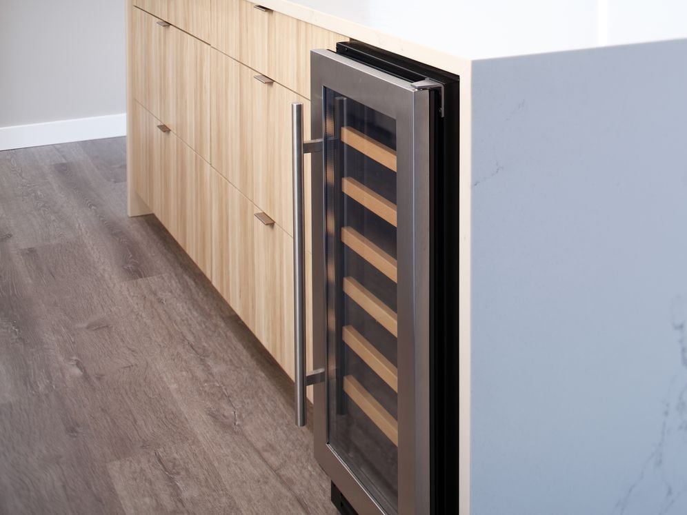 Signature Collection penthouse kitchen with wine center.