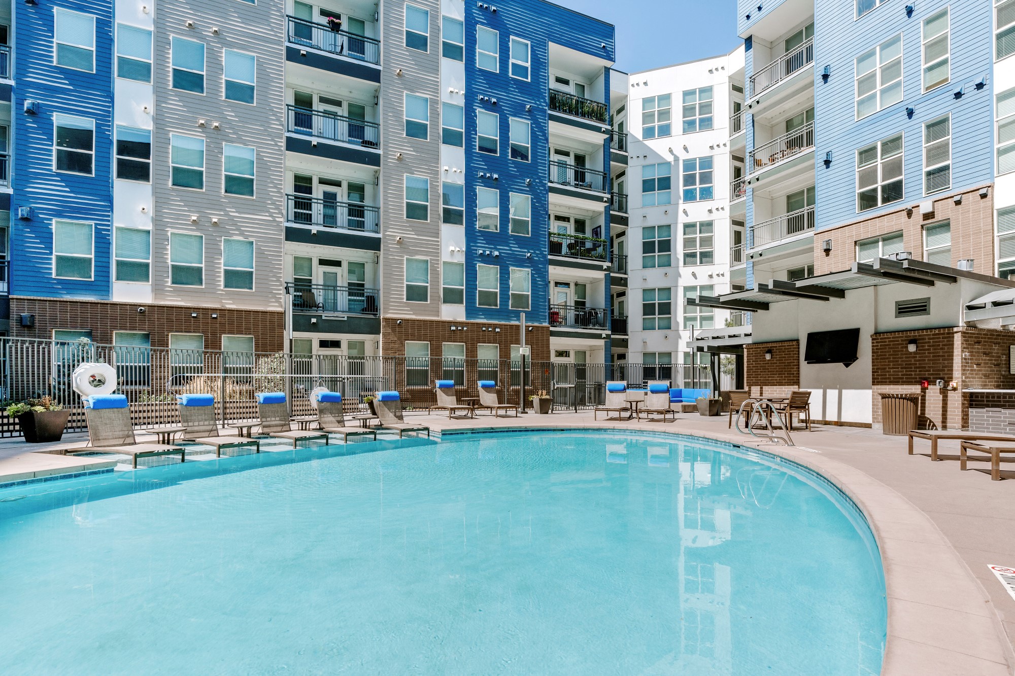 City House Apartments Pool Area and Lounge Chairs
