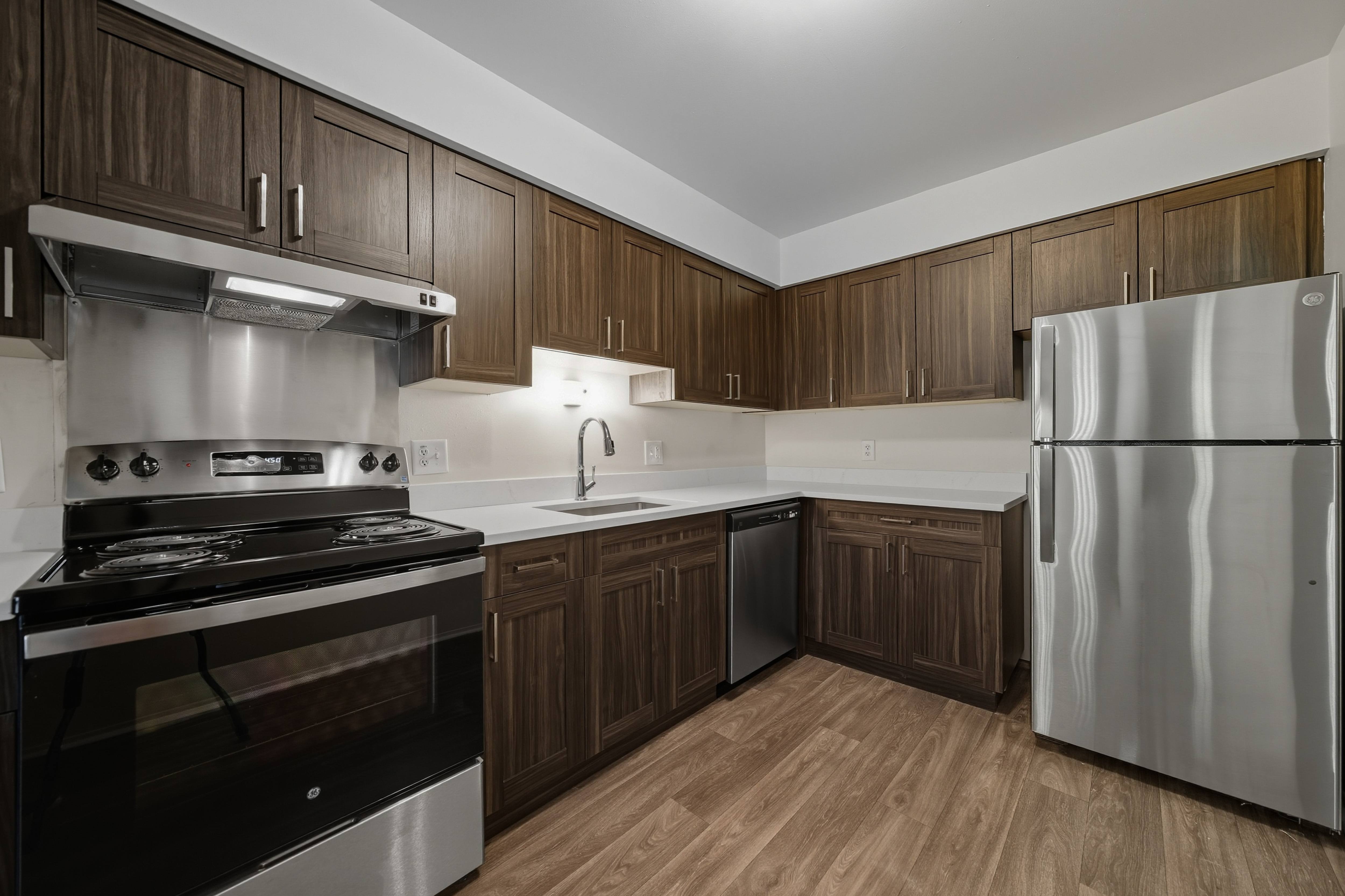 Upgraded Kitchen with stainless steel appliances and quartz countertops at Franklin River Apartments