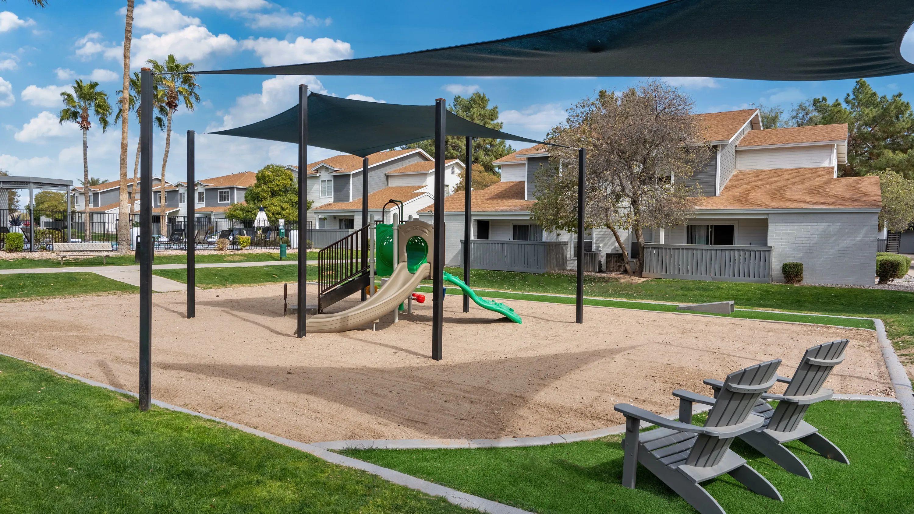 Immerse your family in joy at our vibrant Tot Lot. A sandy play haven, shaded by sail shades, with cozy seating for parents to relax and relish the play. 