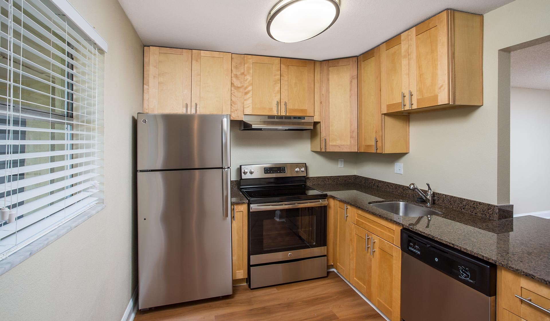 Contemporary floor plans feature kitchens with stainless steel appliances