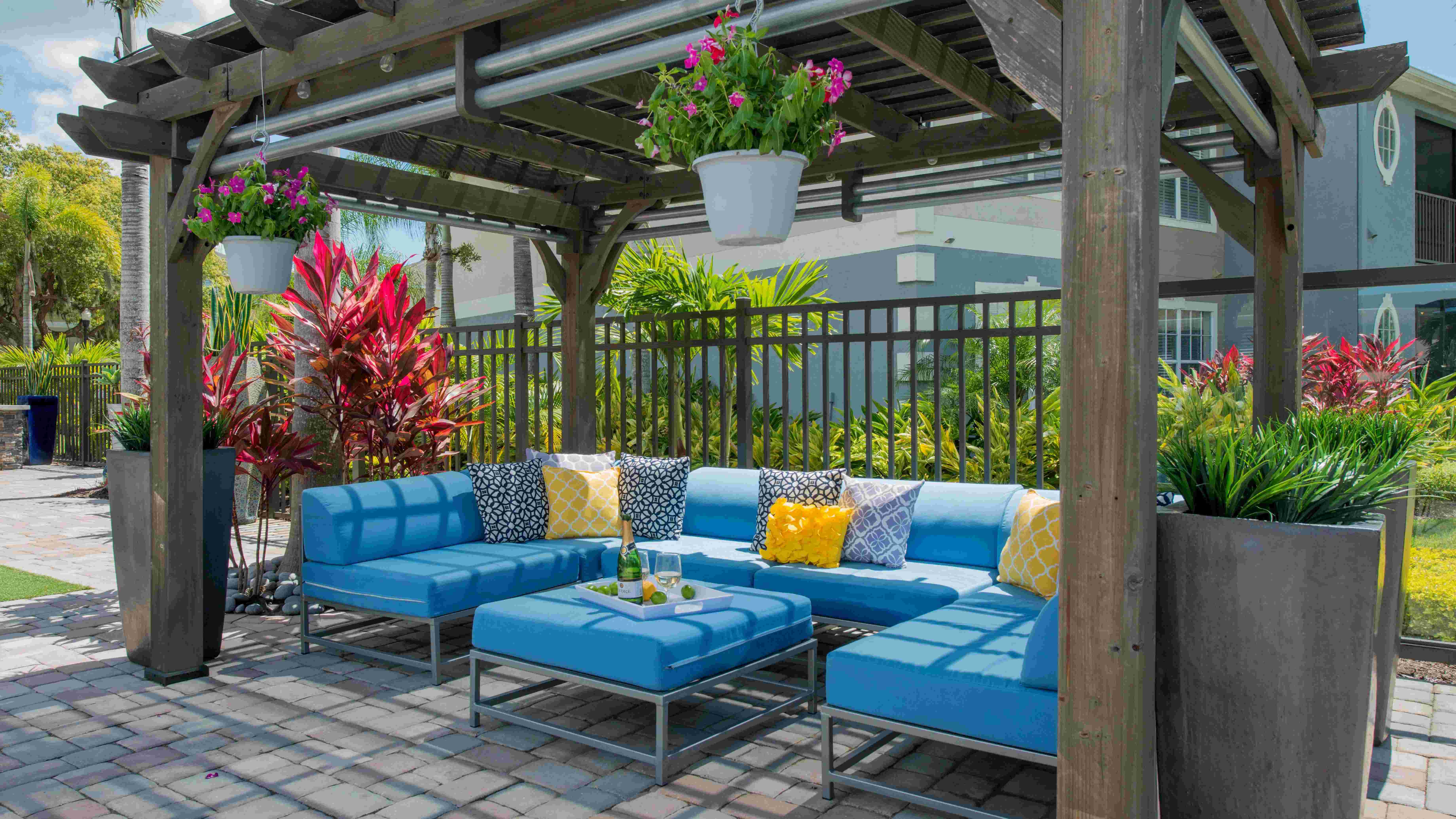 Unwind in shaded comfort and enjoy beautiful lake views under our inviting poolside pergolas, offering a luxe escape for relaxation. 