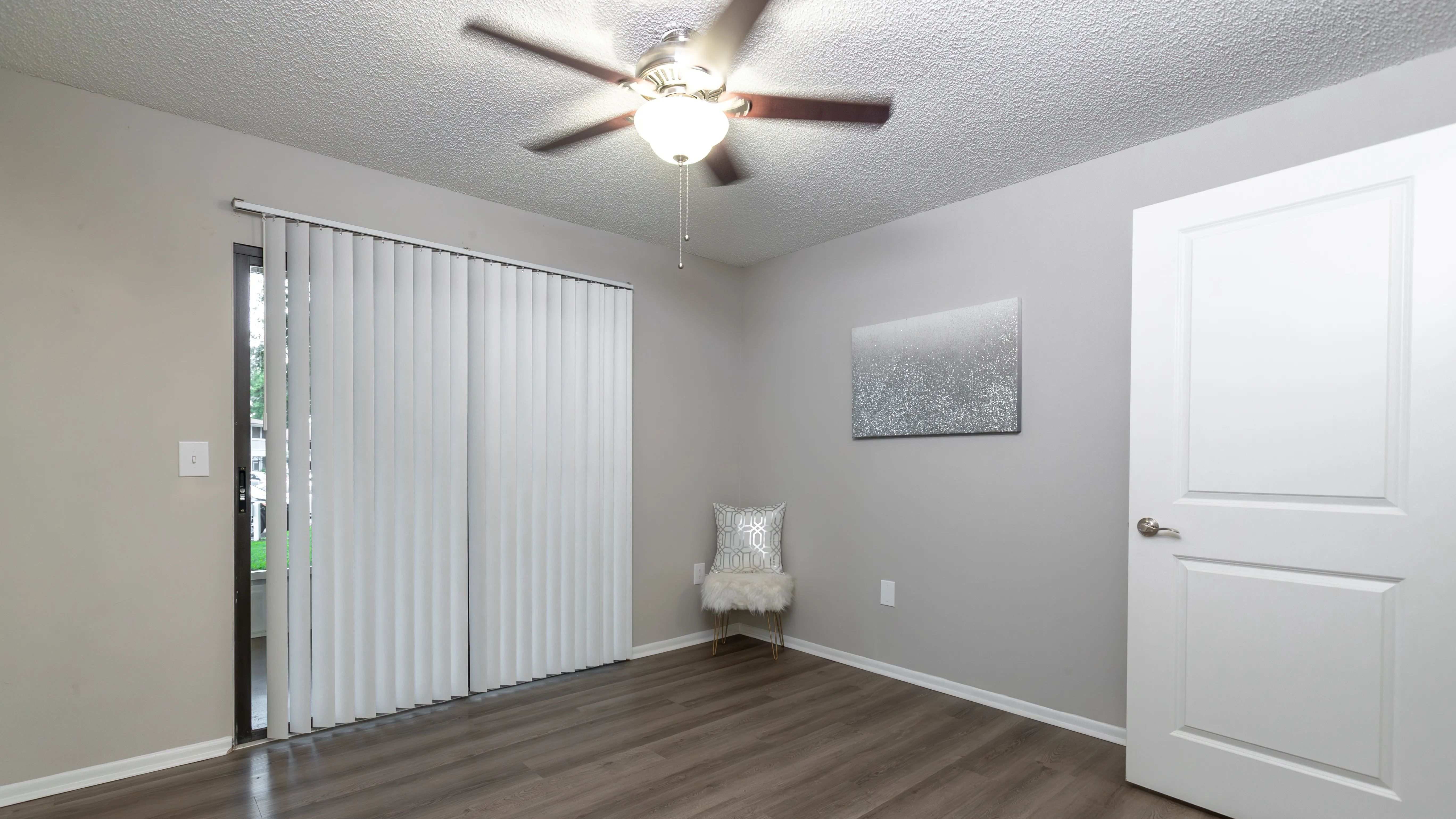 Primary bedrooms, where wood-style floors meet sliding doors to your private patio/balcony – your personal haven.