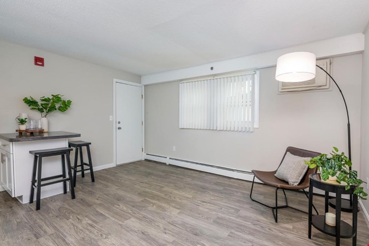 Your spacious living room features large windows allowing natural sunlight to shine through.