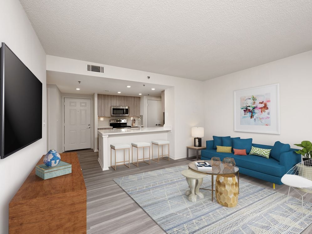 Renovated Package II kitchen, living, and dining areas with hard surface flooring