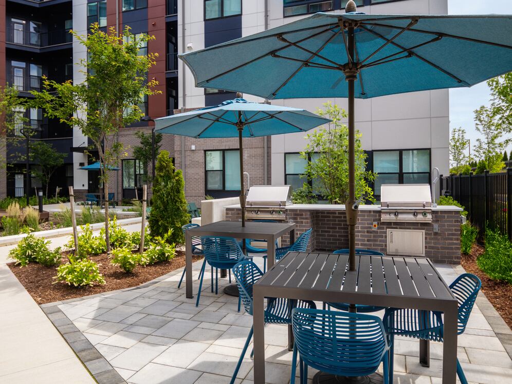 Courtyard #1 featuring fire pit, BBQ grills, and lounge areas