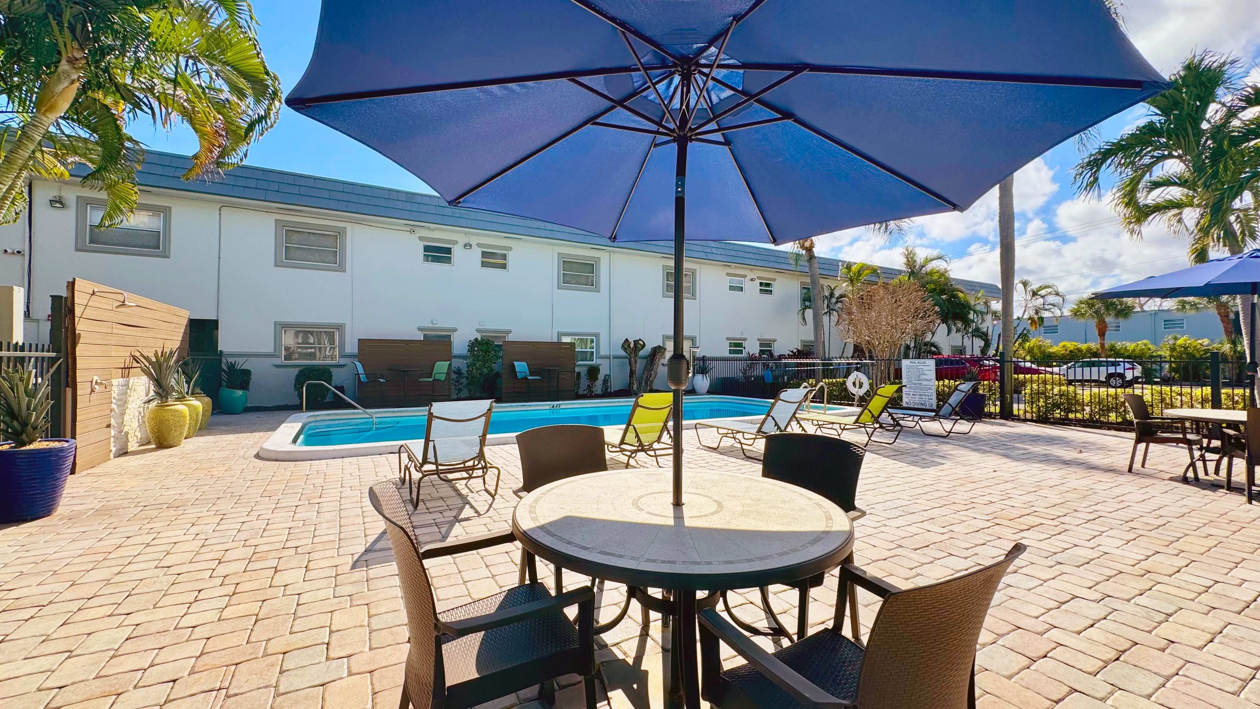 Our expansive sundeck features shaded seating and modern lounge chairs.