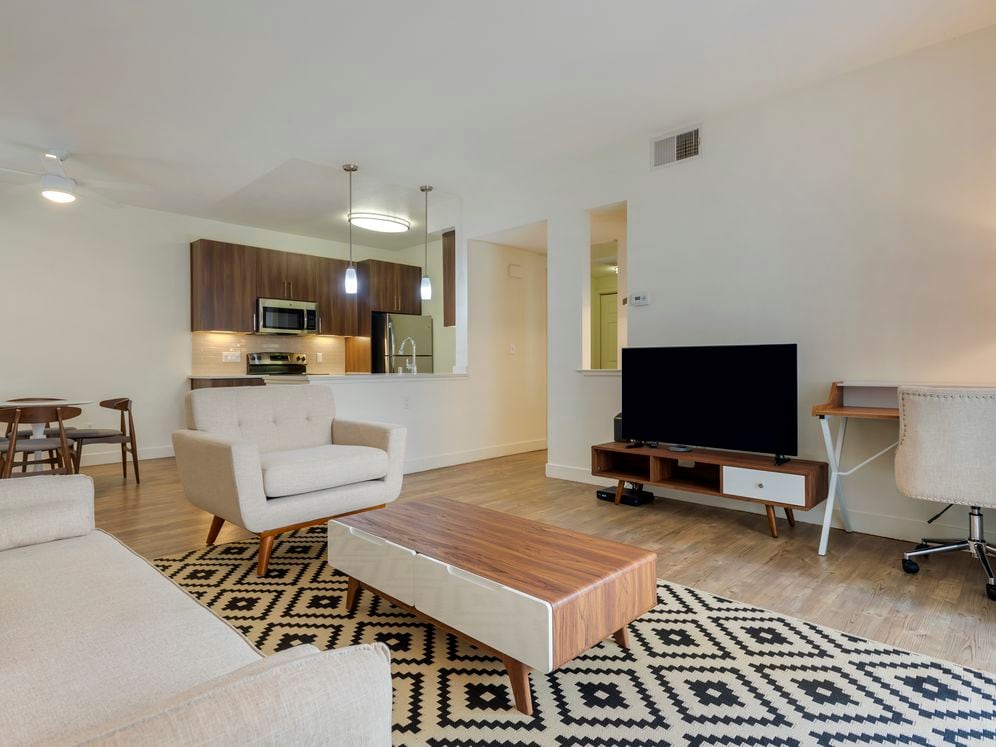 Furnished+ apartment homes include a dining set (Representative Image – exact items and style of furnishings may vary)