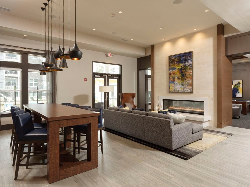 Resident lounge with fireplace and seating