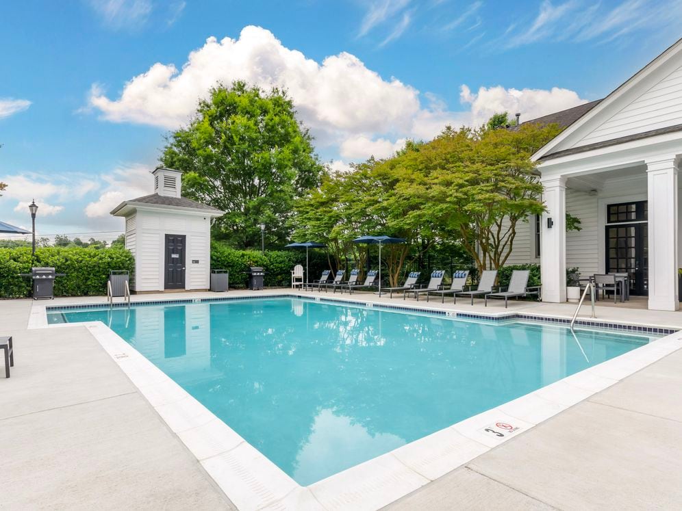 Swimming pool and sundeck with lounge seating