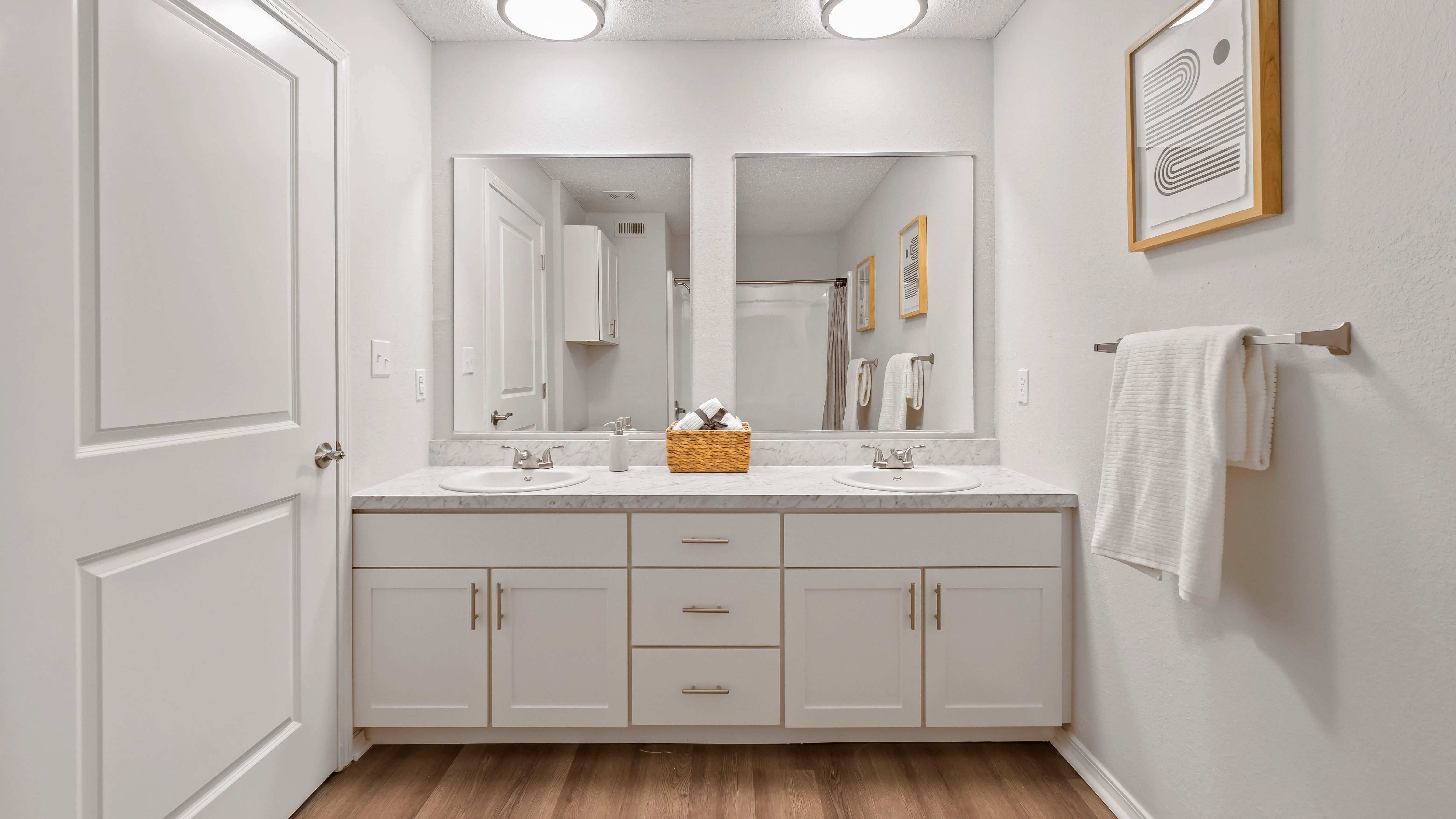 Indulge in the ultimate bathroom experience with dual sinks, separate mirrors, and ample storage in select floorplans.