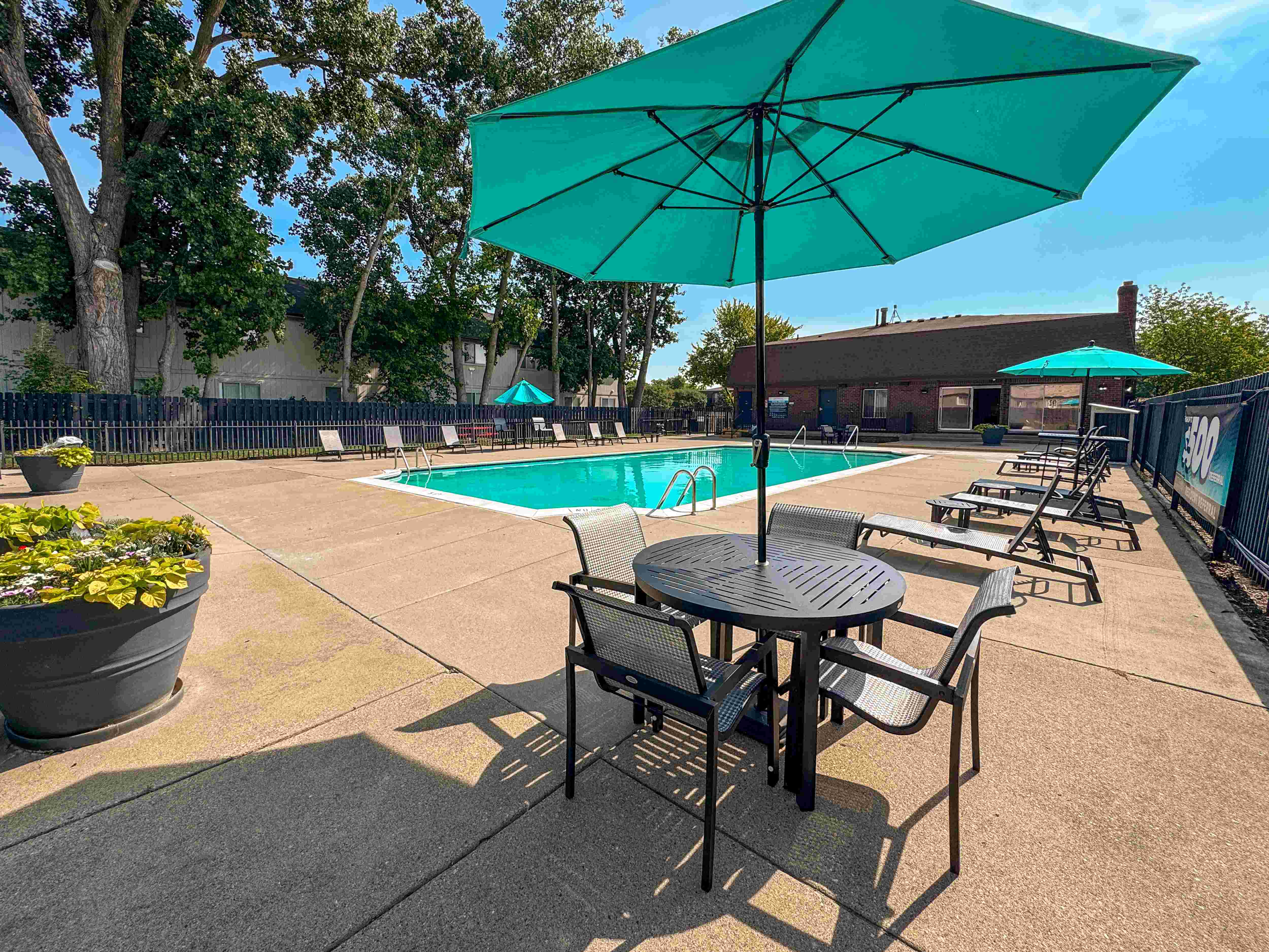 Heated pool and fenced in sundeck at Knottingham Apartments in Clinton Township, MI.