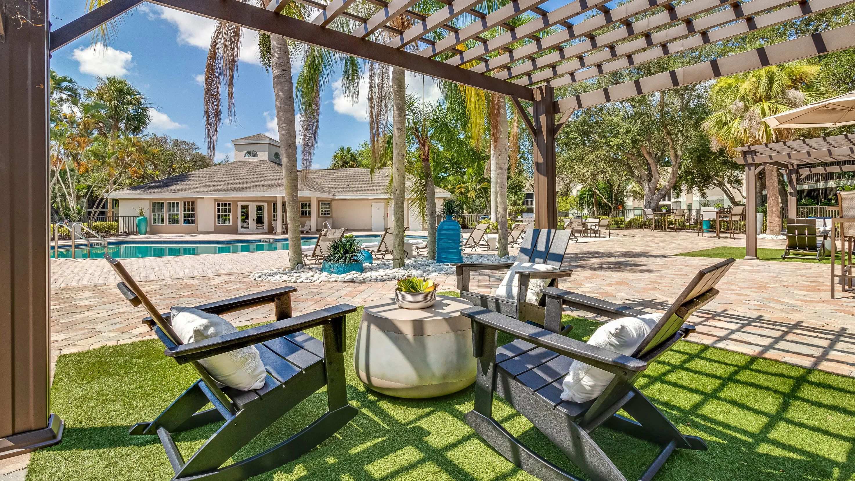 Discover solace beneath our poolside pergolas on the deck.    