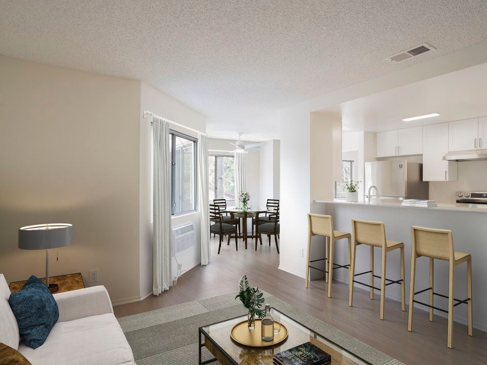 Renovated Package I living and dining room with hard surface flooring