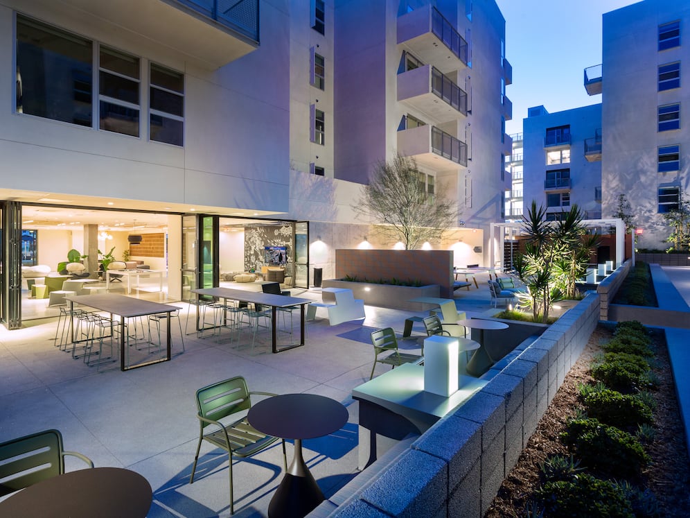 Indoor/outdoor chill space with barbecue grills and seating