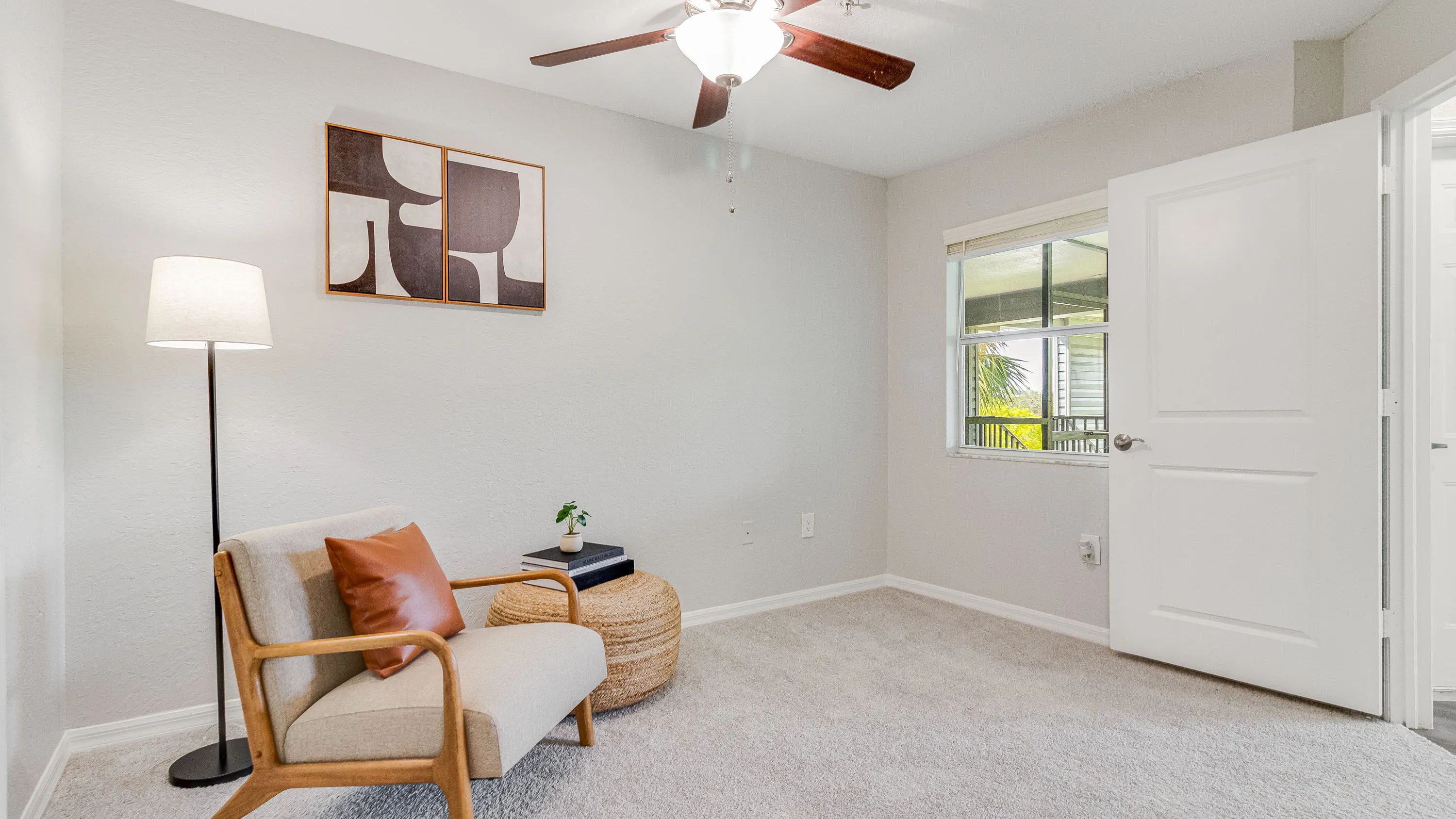 Spacious bedroom with multi-speed ceiling fan.