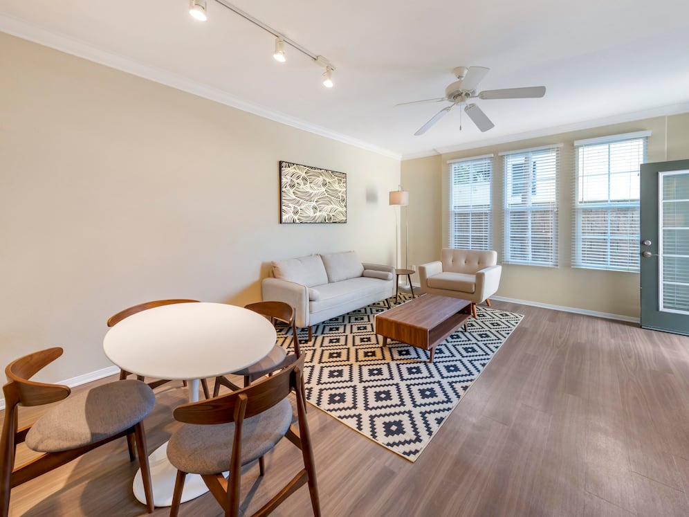 Furnished+ apartment homes include a dining set (Representative Image – exact items and style of furnishings may vary)