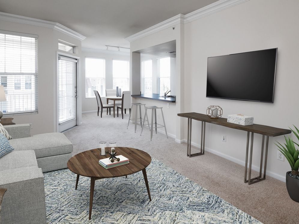 Finish Package I kitchen and living areas with oak cabinetry, black laminate countertops, stainless steel appliances, and tile flooring