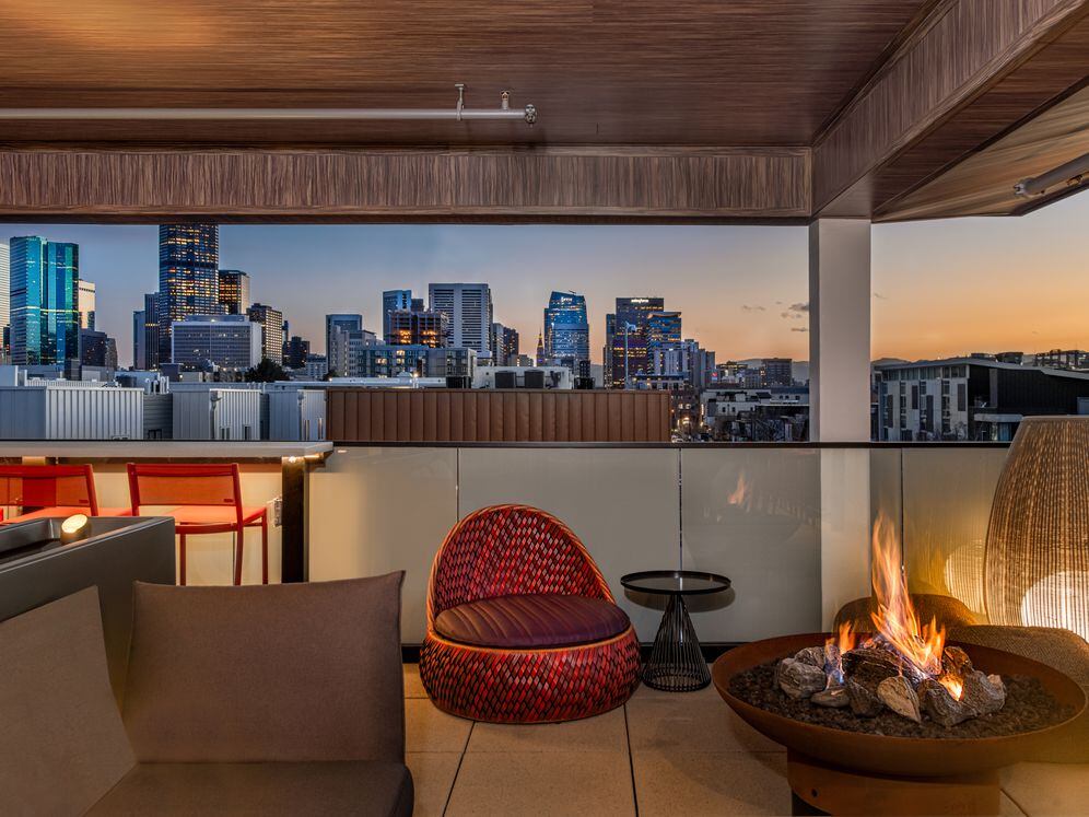 Rooftop lounge with fireplace and seating