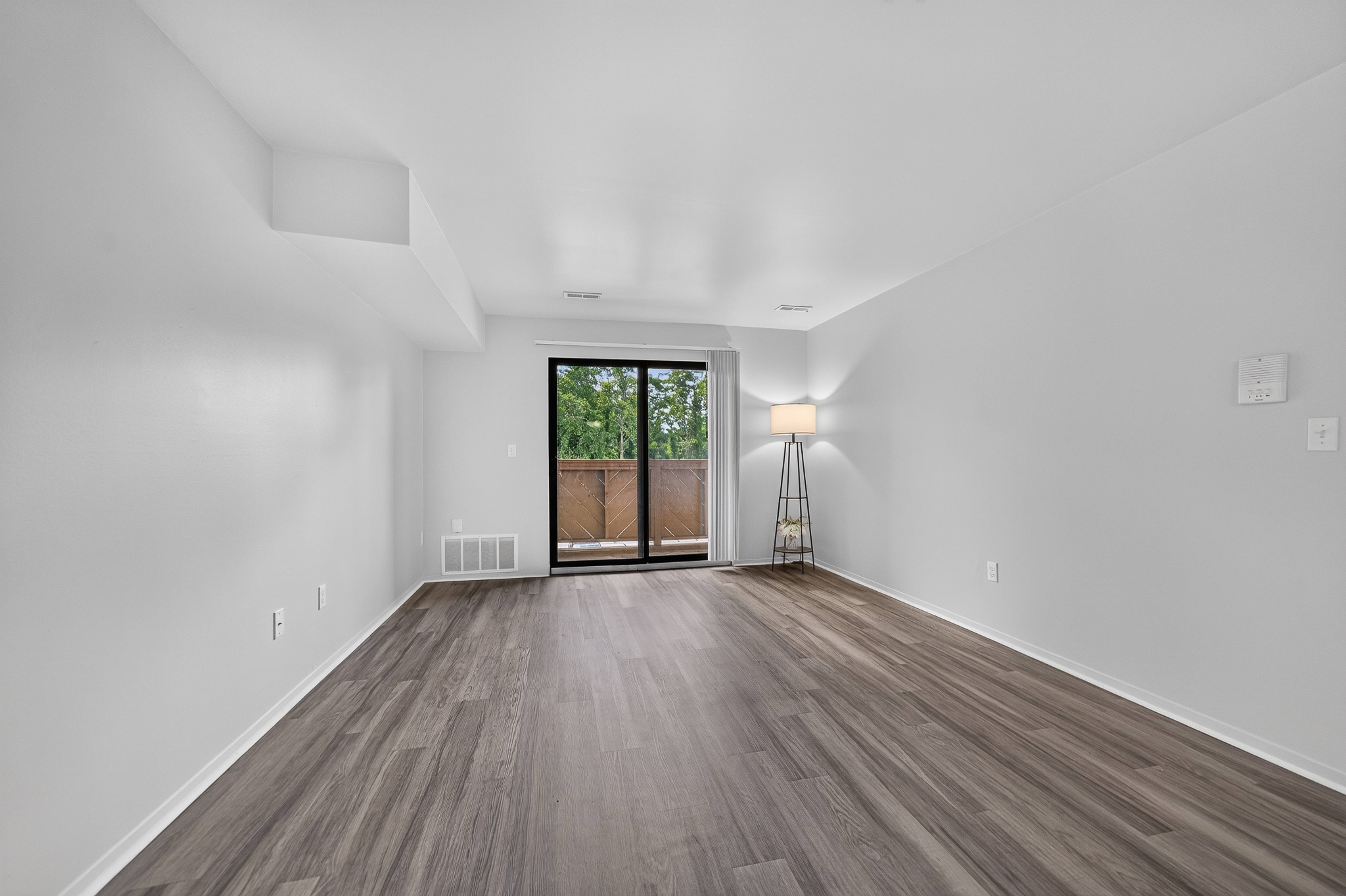 Spacious living room at Woodland Villa Apartments in Westland, MI.