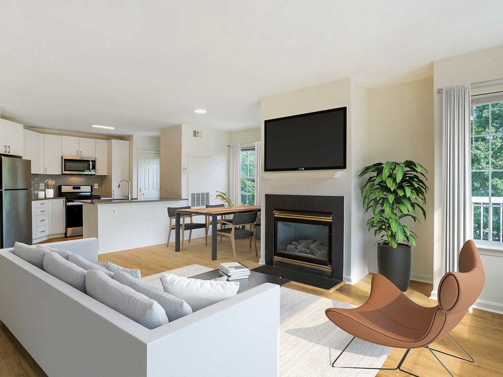 Renovated Package IV kitchen, living, and dining areas with hard surface plank flooring