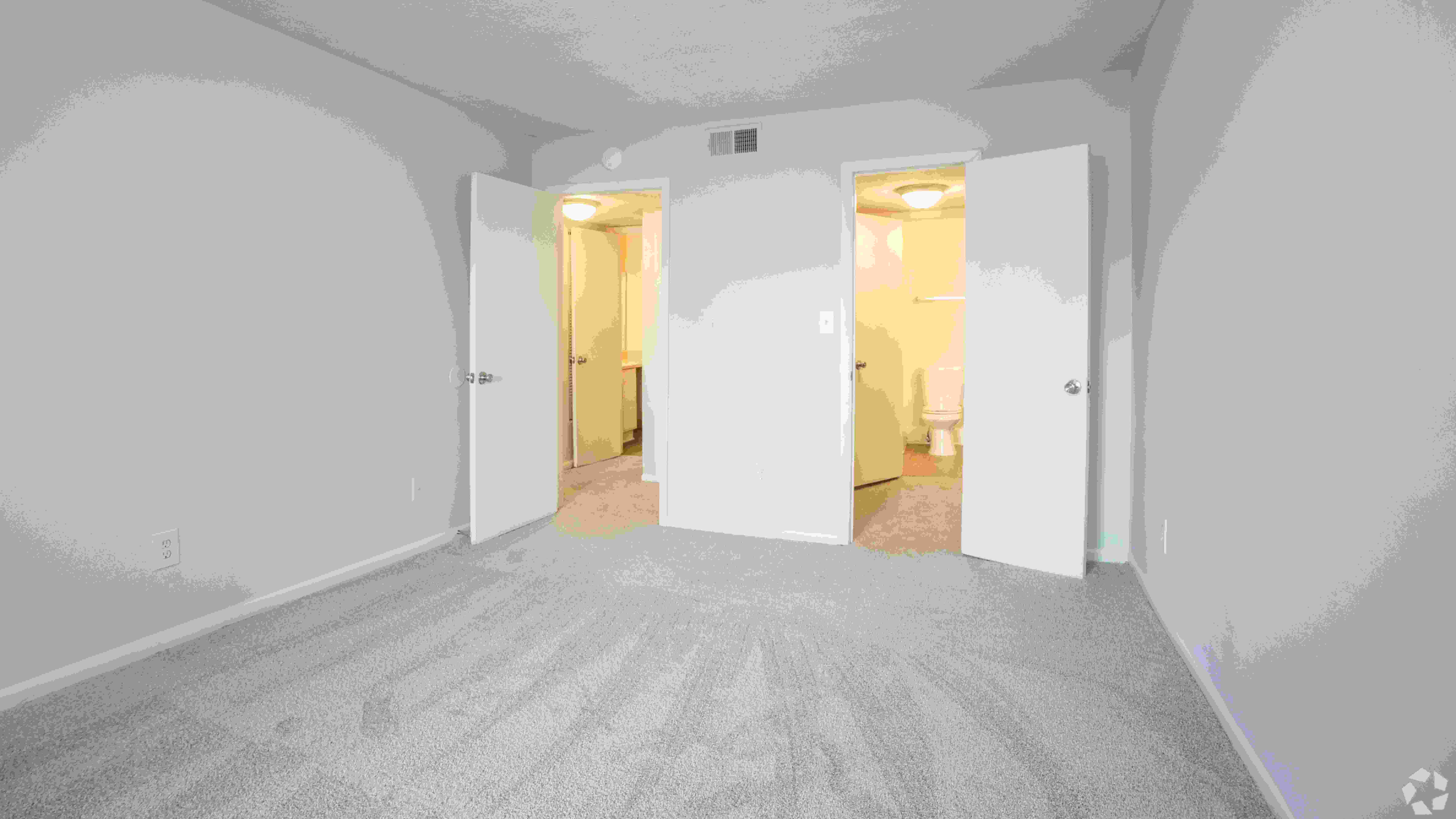 Spacious master bedroom in The Whitlock floor plan, designed for comfort and convenience with direct access to the master bathroom.