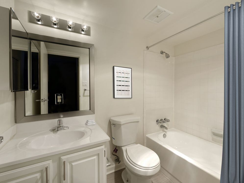 Finish Package II bathroom with white cabinetry and countertop