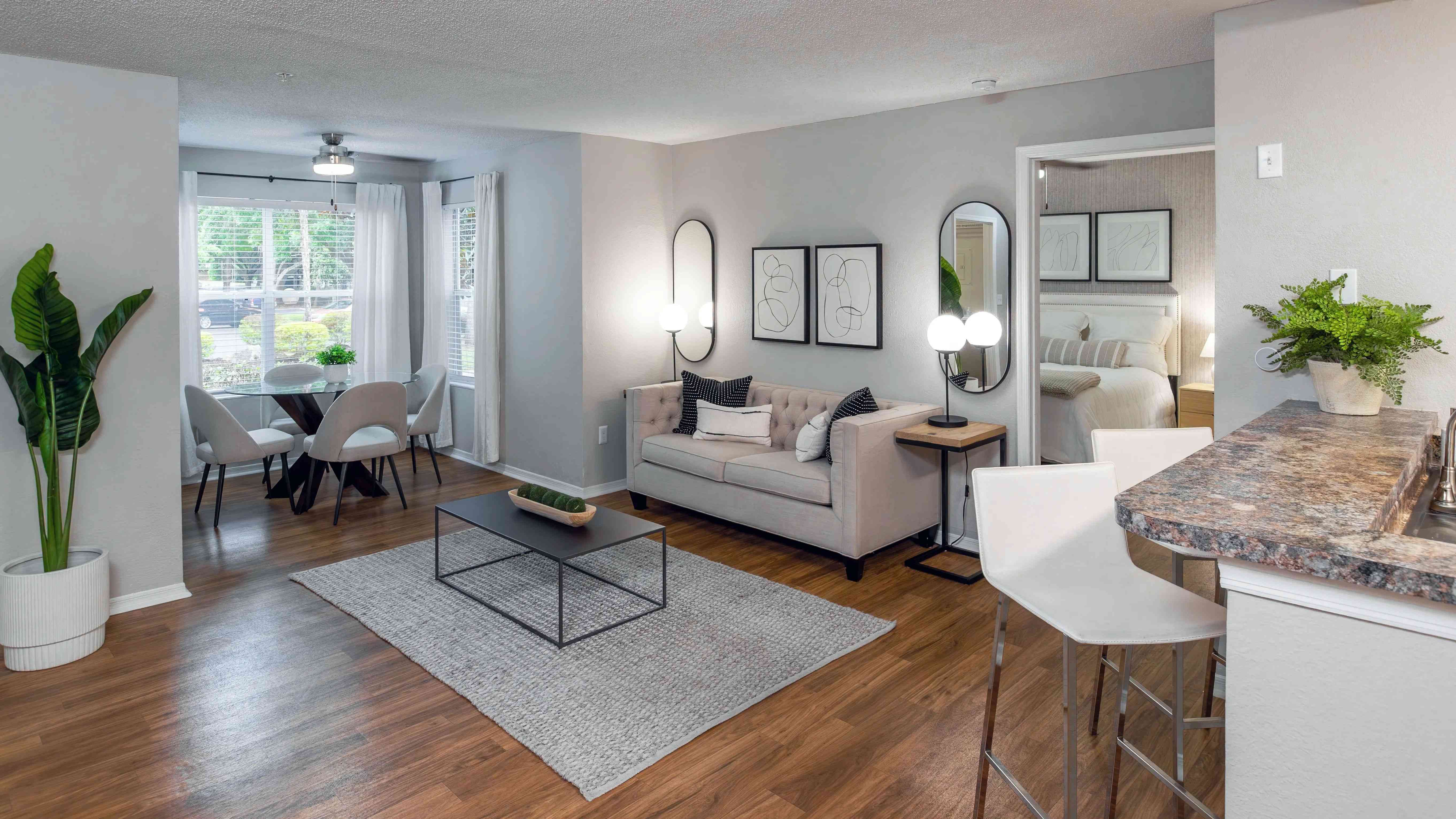 This thoughtfully designed living room flows effortlessly into the solarium, creating a light-filled space perfect for both entertaining and relaxing.