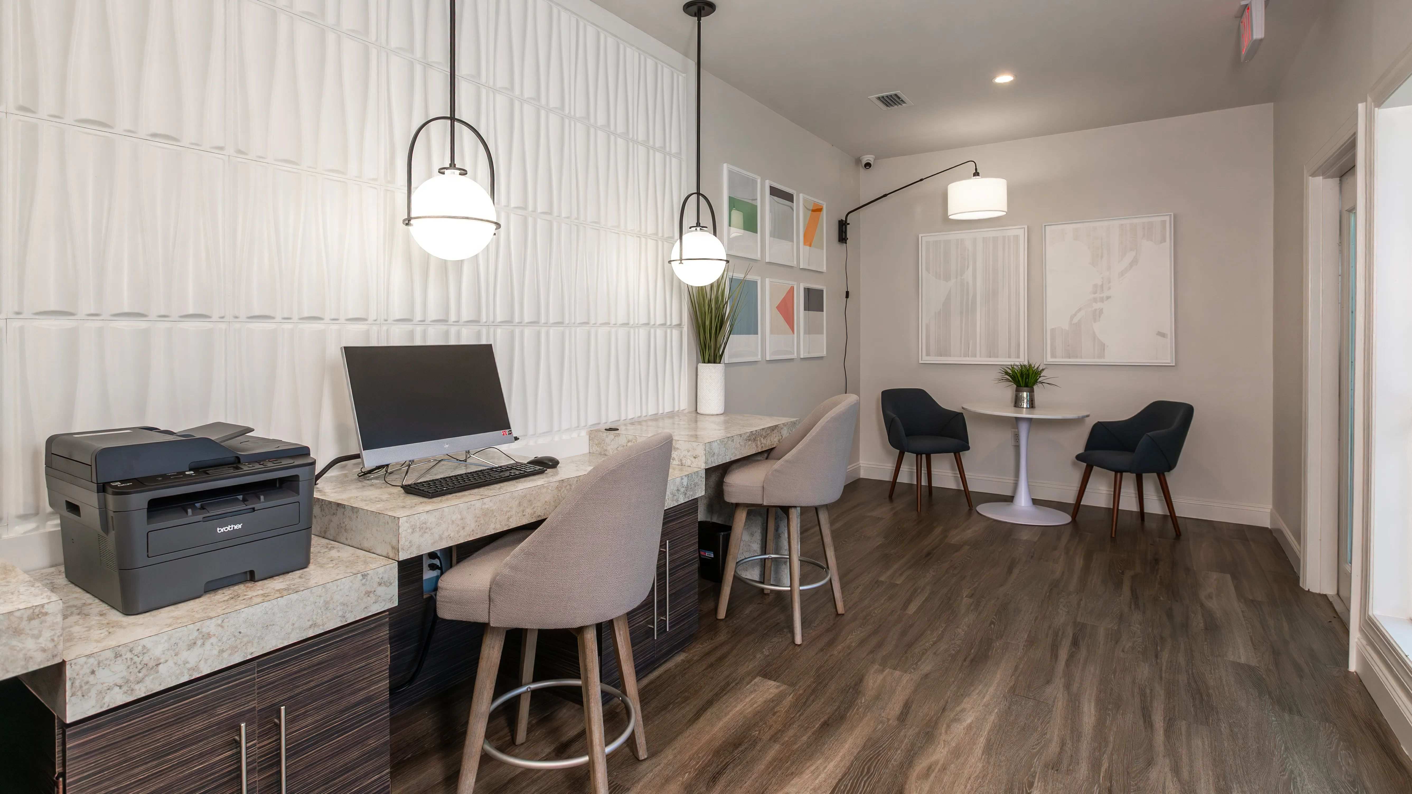 Stay productive at Grand Oaks Apartments with our stylish resident business center, complete with computer stations, high-speed internet, printer access, and comfortable seating.