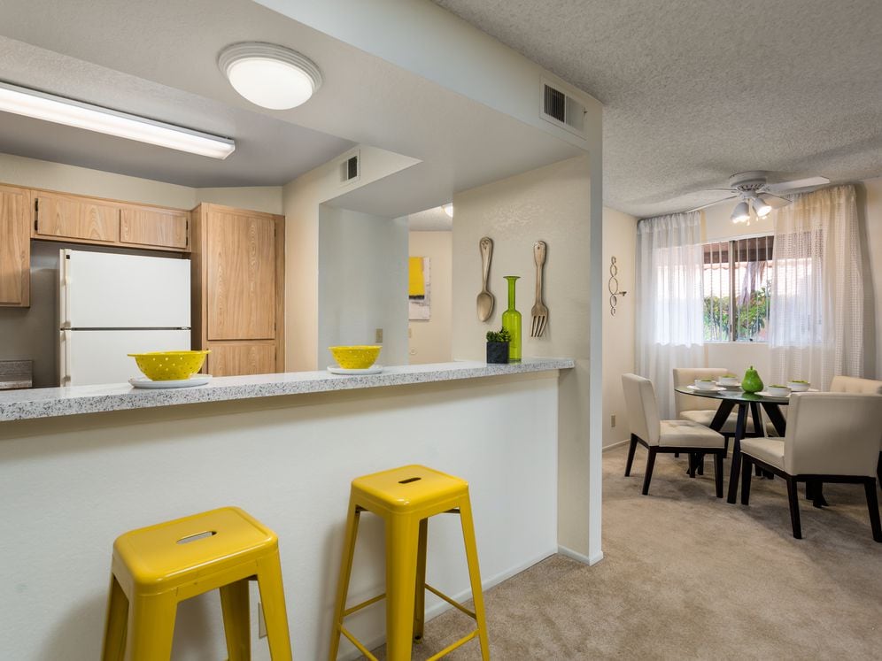 Classic Package living and dining areas with carpet