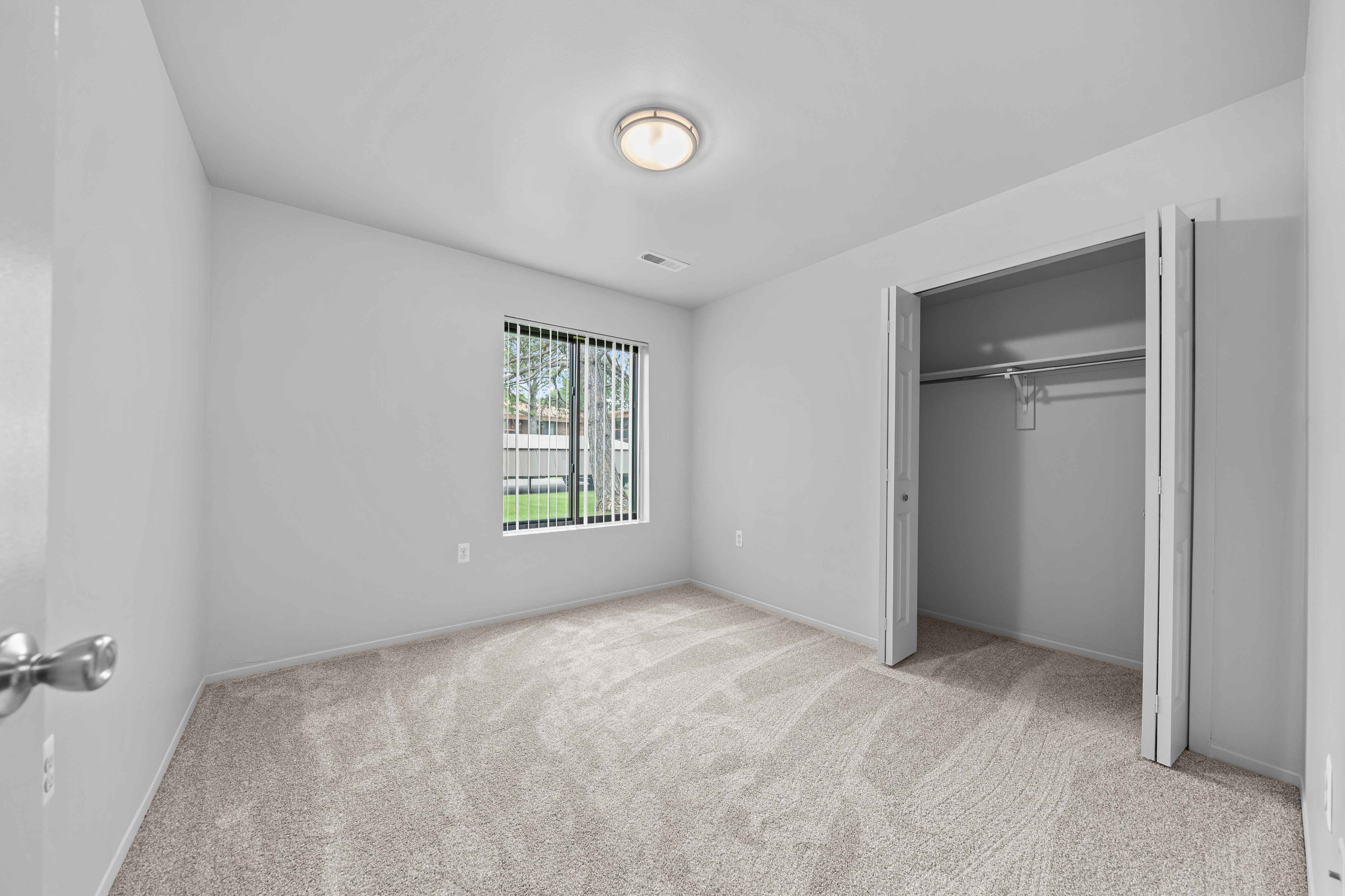 Big bedroom with natural lighting at Westwood Village Apartments in Westland, MI