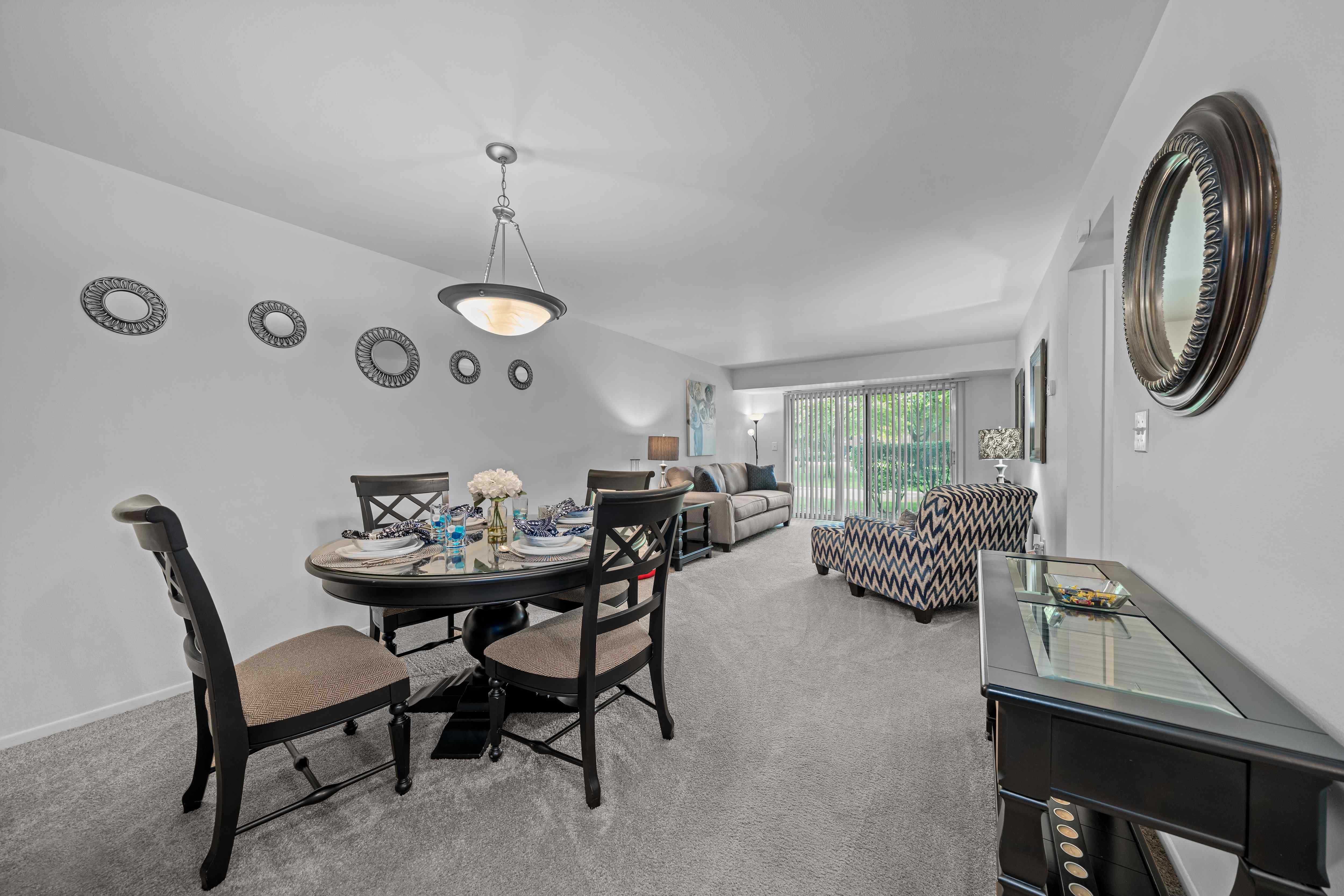 Spacious living/dining room with natural light at Westwood Village Apartments in Westland, MI