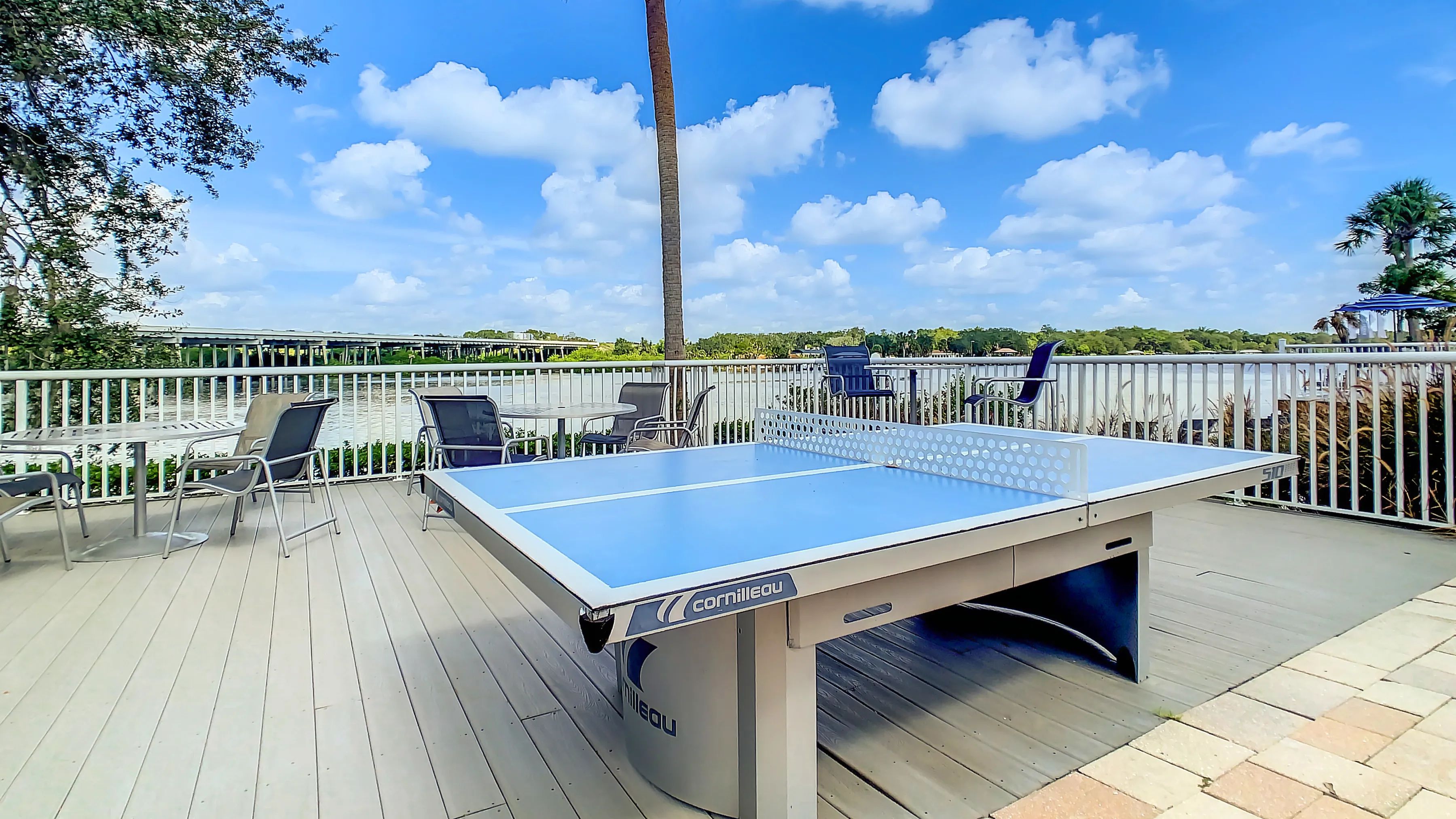 Engage in a game of ping pong or unwind while enjoying refreshments on the outdoor deck, an extension of the oversized pool deck.