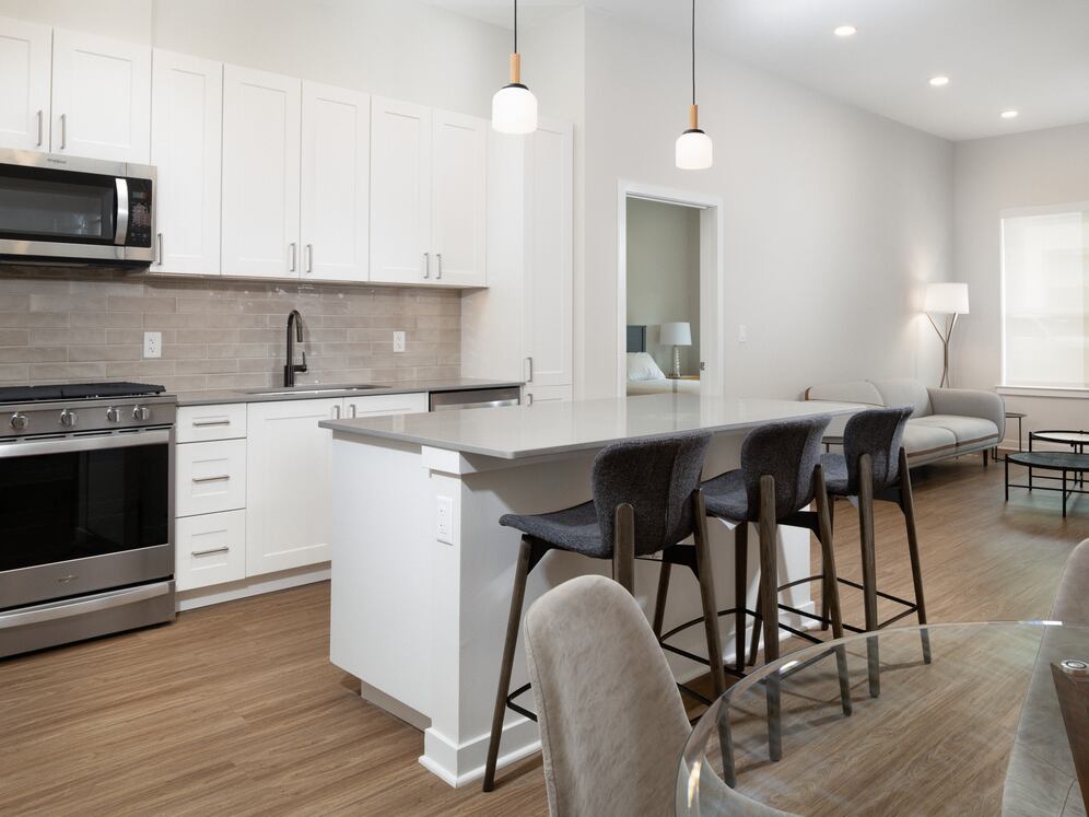 Upgrade Collection Kitchen, living, and dining areas with hard-surface vinyl plank flooring