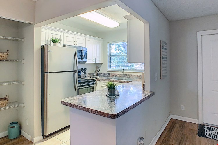 Elevate your culinary adventures with stainless steel appliances, a generous pantry, and ample countertop space. Cooking in style is part of the pleasure of apartment living at Boca Winds.