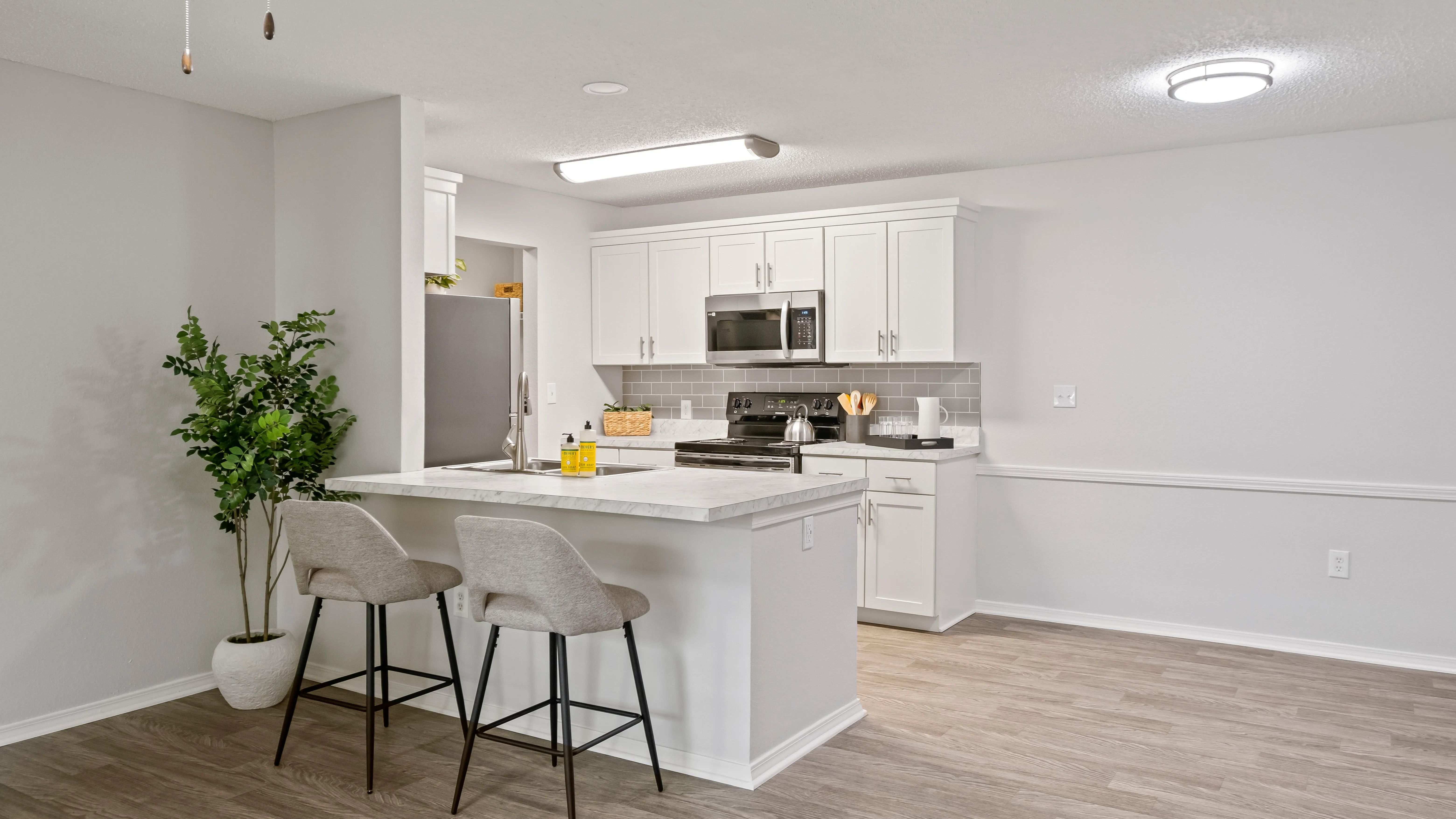 Every kitchen is designed for joyful living, with an oversized, luxurious countertop perfect for bar seating and lively entertainment. 