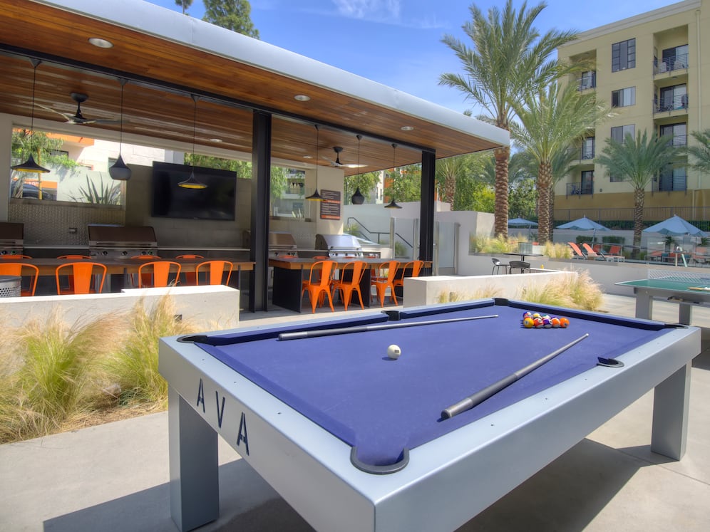 Outdoor Kitchen with Grills and Game Tables