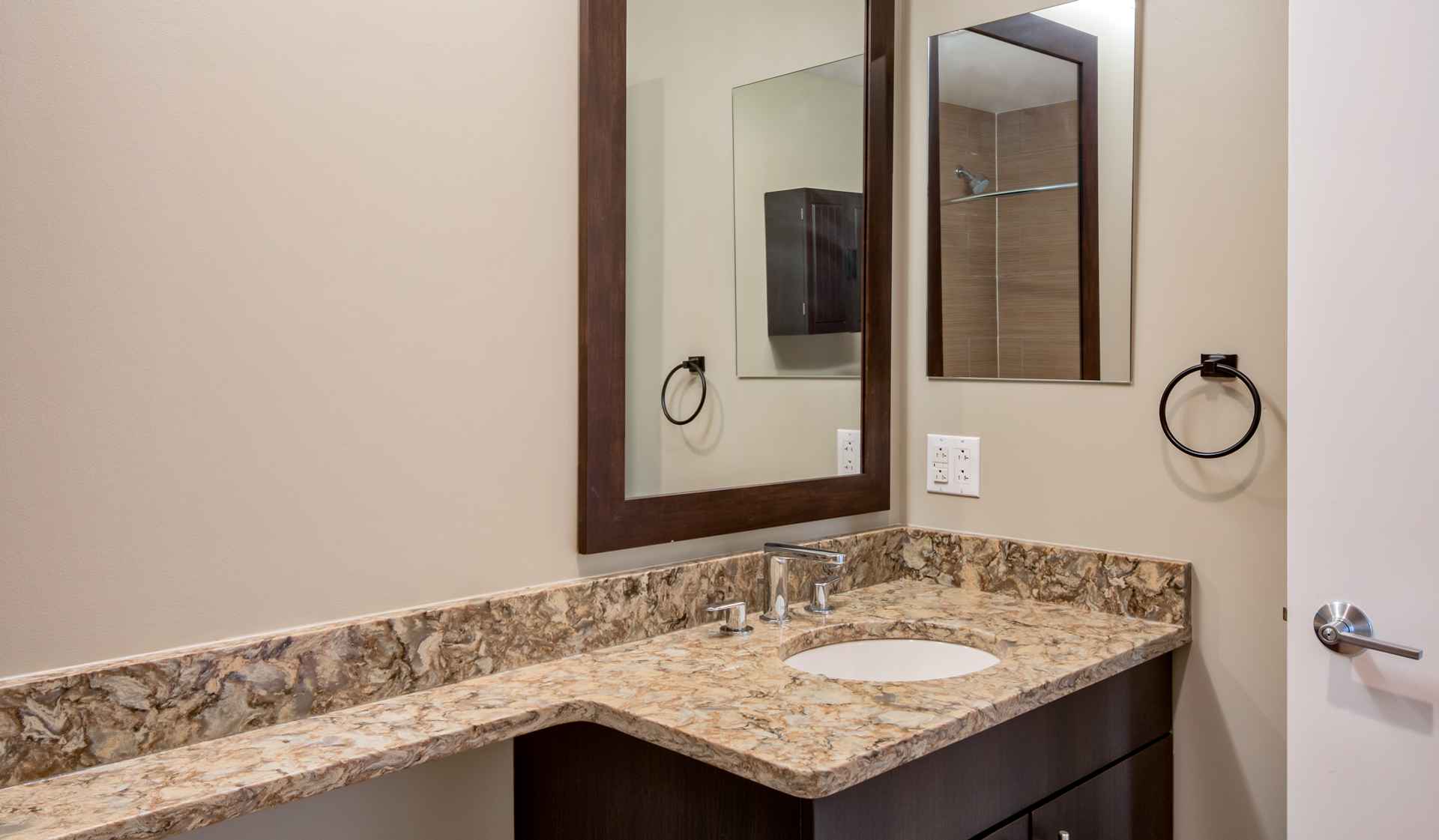 Bathrooms with upgraded finishes and glass showers in select homes