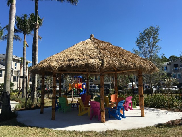 Tiki Hut with relaxing Adirondack Chairs