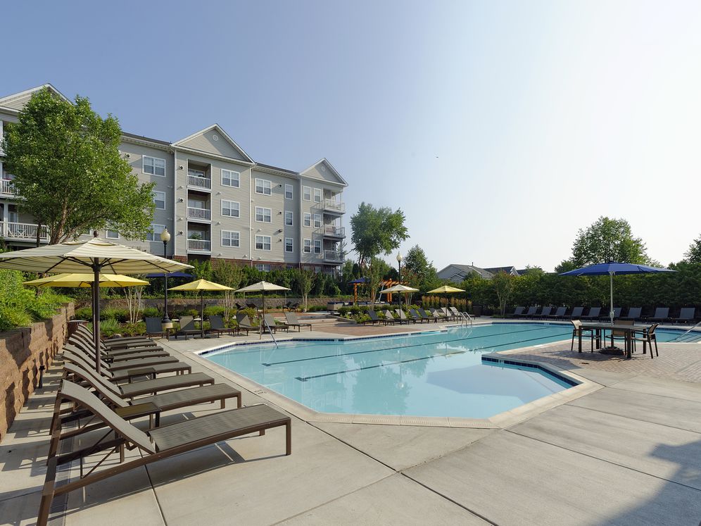 Swimming pool and sundeck with lounge seating