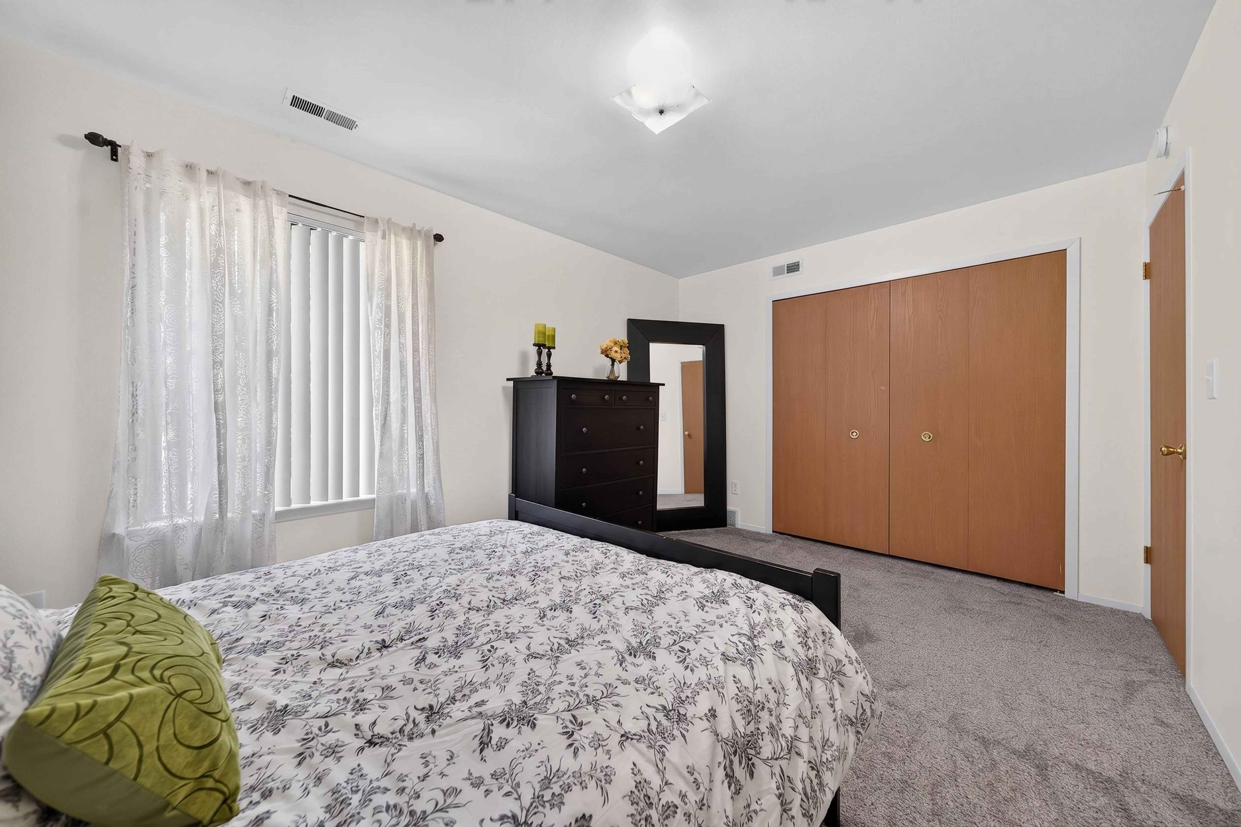 Spacious bedroom with ample storage space at Eastwood Village Apartments in Clinton Township, MI.