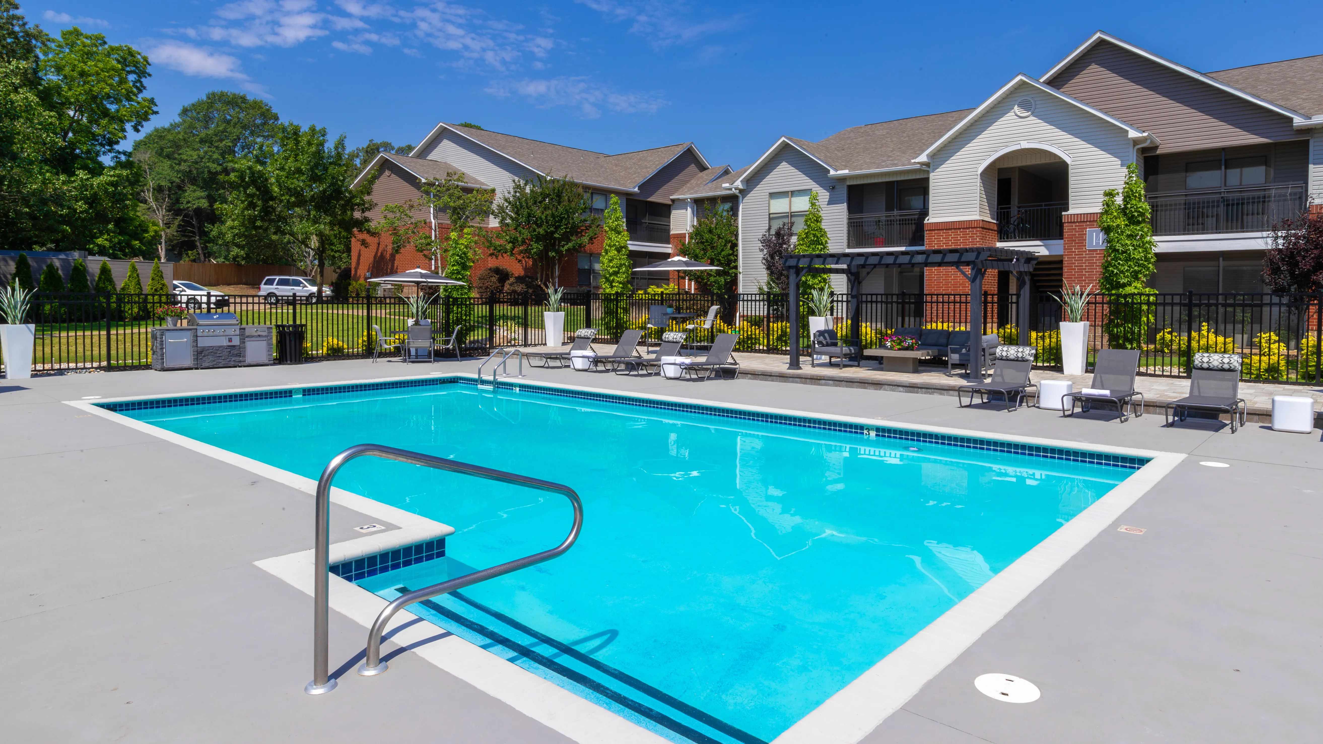 Dive into relaxation at our sparkling swimming pool and sundeck, featuring modern amenities and lush surroundings.