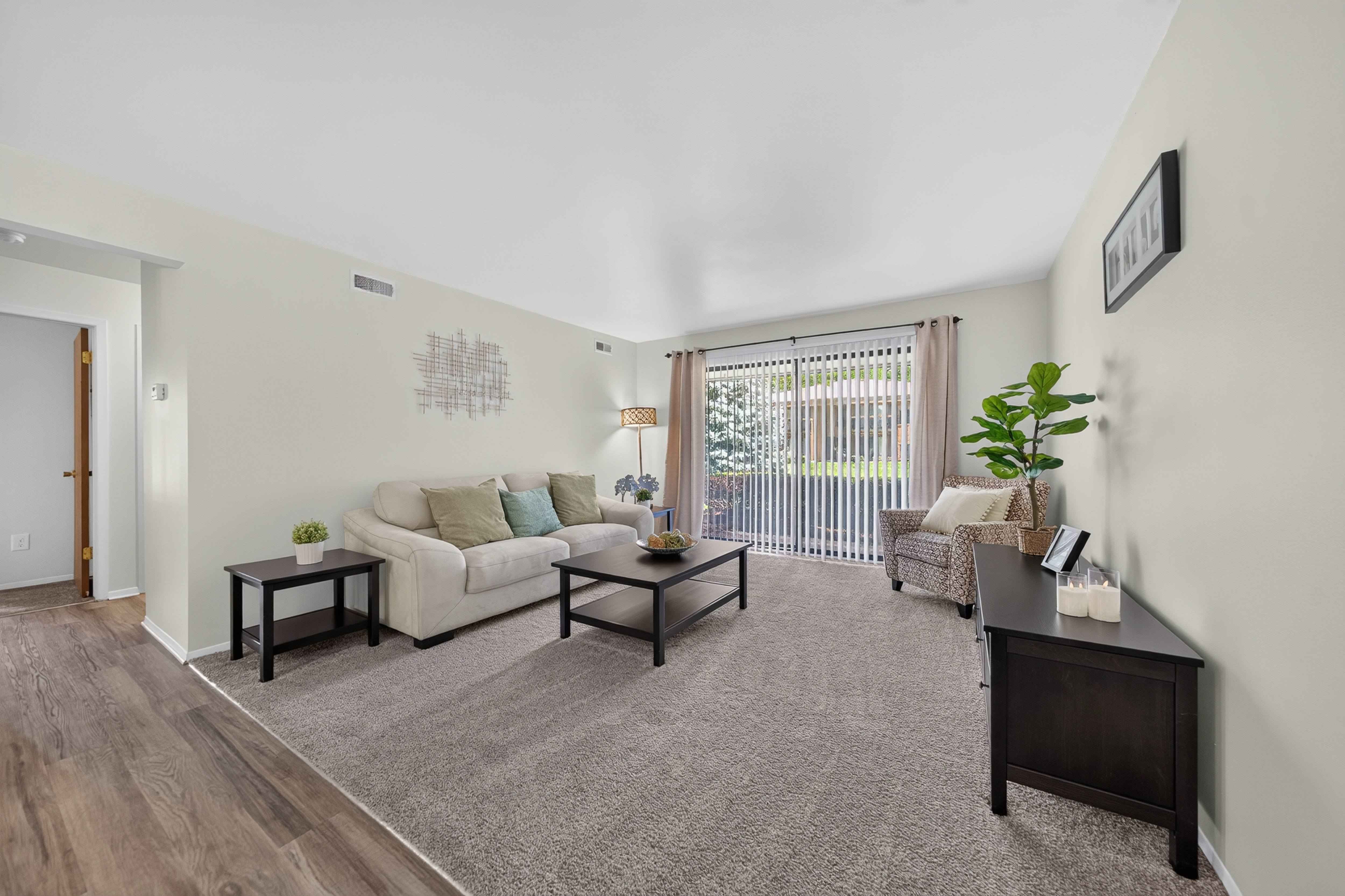 Open living room with natural light at Eastwood Village Apartments in Clinton Township, MI.