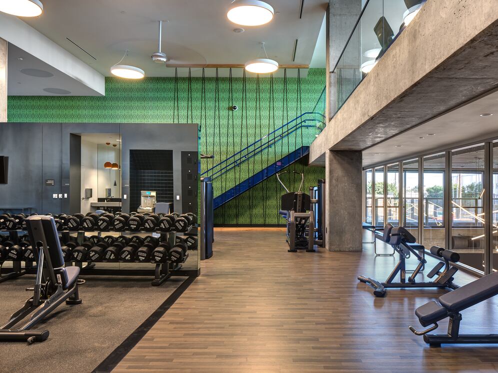 Two-level fitness center with cardio and strength equipment