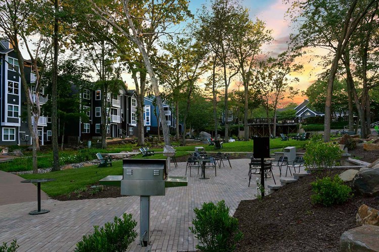 Courtyards nestled throughout the community feature grills and lounge seating