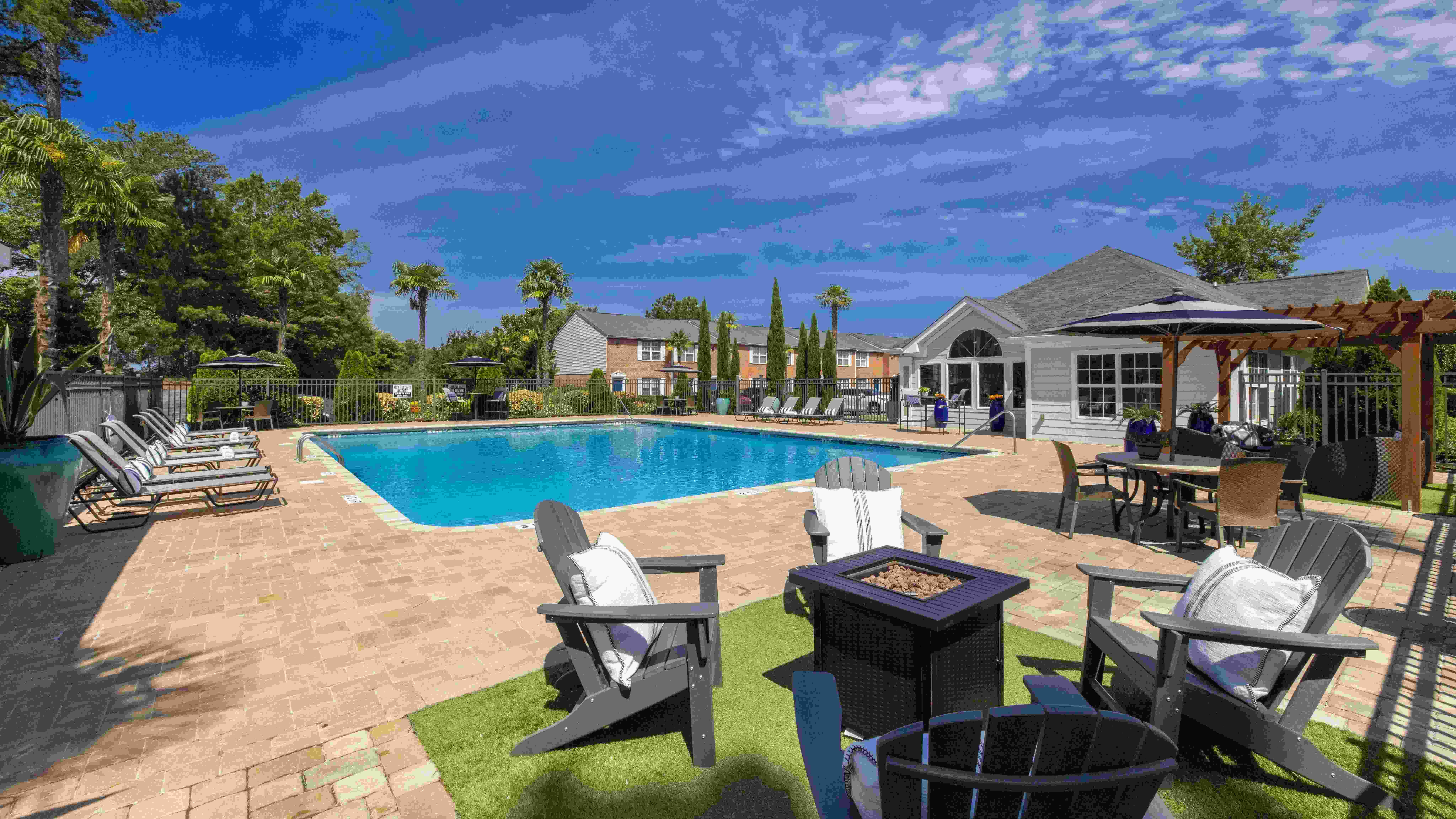 Embrace warmth and ambiance by our inviting poolside fire pit.