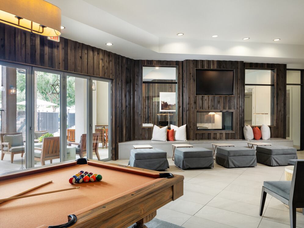 Lounge with billiards and multiple seating areas