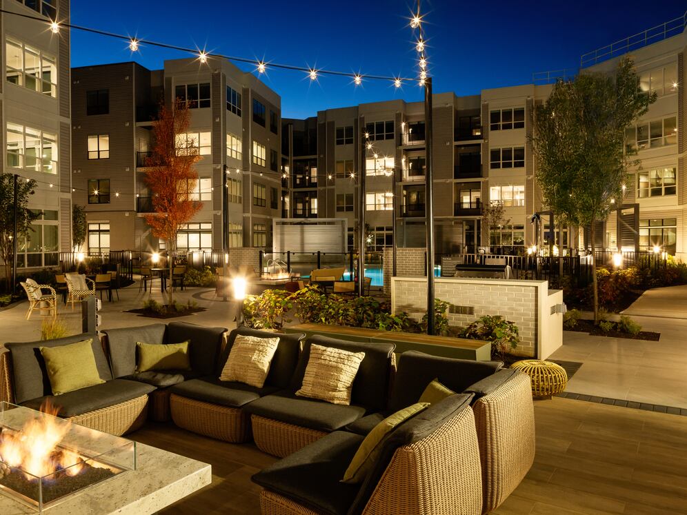 Courtyard with BBQ grills, fireplace, and lounge seating