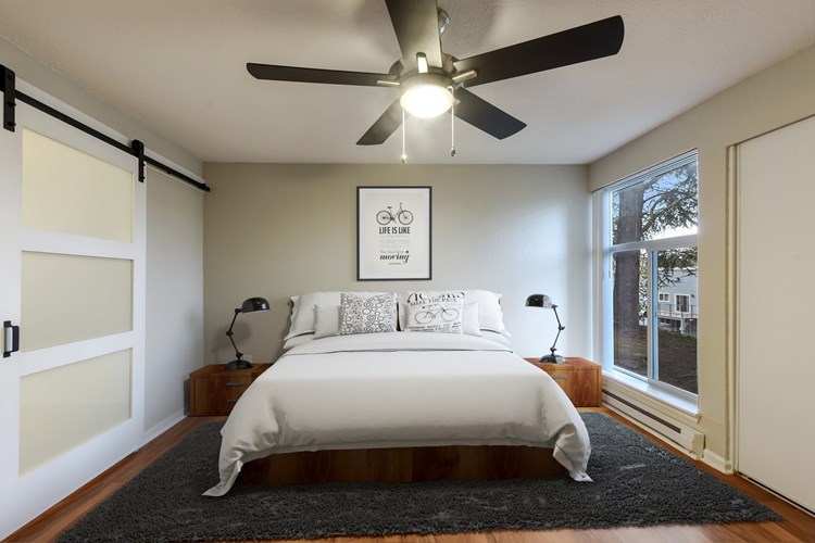 Premier master bedroom features a private bathroom and sliding barn door